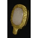 An attractive jade and gilt metal Belt Buckle,mid Qing, the central white jade boss carved with
