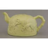 A yellow-glazed teapot, Republic period (1912-1949), moulded with two horses in a continuous