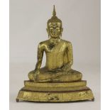 A gilt bronze Buddha, 19th century, seated in Bhumisparsa mudra with removable ketumala, the robes