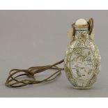 A mother-of-pearl Snuff Bottle,20th century, the ovoid body with panels of birds and a peony against