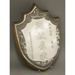 A silver Presentation Plaque,early 20th century, of shield form with presentation inscription in