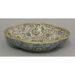 A cloisonné dish, 20th century, of quatre lobed form, decorated throughout with lotus flowers
