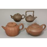Yixing teapots and covers, 20th century, variously modelled with tree rats and branches, engraved