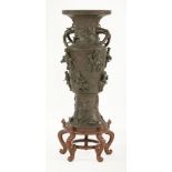 A large bronze Vase,late 19th century, the conical body applied with the Eight Daoist Immortals, the