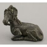 A bronze Scroll Weight,probably late Ming/early Qing, cast as a recumbent mythical beast, the detail