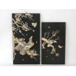 Two black-lacquered Panels,c.1880, each with an eagle sitting on a blossoming branch eyeing at a