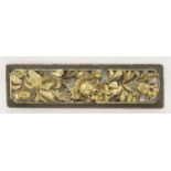 A gilt wood plaque, deeply and vigorously carved with a feng amongst peony, 62 x 17cm