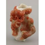 A carnelian agate spill vase, 20th century, pierced and carved with a fruiting tree with peaches,