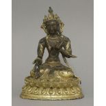 A bronze Bodhisattva, 20th century, seated cross legged with varada and jnana mudra on a lotus