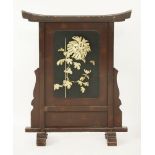 A torii form Fire Screen, c.1900, with high relief carved bone chrysanthemum, bamboo shoot and