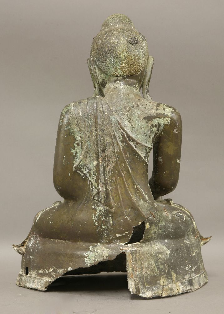 A bronze Buddha,19th century, seated in Bhumisparsa mudra on a stepped platform,44cm - Image 2 of 2