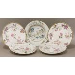 Five various porcelain famille rose Plates,18th century, four with floral design and one with houses
