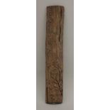 A wooden arm rest, 20th century, possibly aloeswood, carved in relief with a branch in the lower