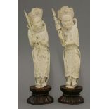 A pair of ivory Heavenly Kings,early 20th century, each in chain-mail, one, the Protector of the