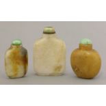 Three hardstone snuff bottles, 19th-20th century, one in a finely flecked off-white stone, another