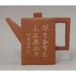 A Yixing teapot and cover, 20th century, the rectangular section tall body incised and white