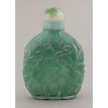 A large glass Snuff Bottle,20th century, the flattened ovoid body cut with egrets stalking amongst