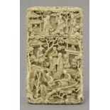A Canton ivory Card Case, mid 19th century, well carved with figures seated in a garden surrounded