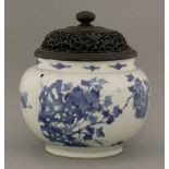 A blue and white Jar,Kangxi (1662-1722), of ovoid form on circular foot, painted with peony and