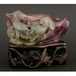 An unusual amethyst Brush Washer,20th century, the crystalline stone worked as a large lotus leaf,