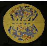 A yellow-ground Banner,early 20th century, richly embroidered with dragons amongst clouds chasing