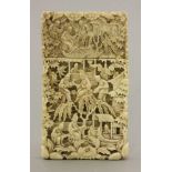 A Canton ivory card case, early 19th century, typically carved with figures and pavilions, 9.3cm