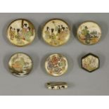 A pair of 'Satsuma' buttons, enamelled and gilt with men and ladies in interiors, shimazu mon marks,