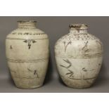 Two Cizhou Vases,Ming dynasty (1368-1644), each ovoid body with a yellow glaze, painted in brown