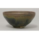 A small hares fur bowl, Song dynasty or later, the copper coloured rim streaking running into black,