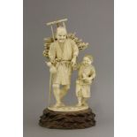 An ivory Okimono, c.1880, of a faggot collector with a staff and a double gourd in his right hand,