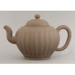 A Yixing teapot, 20th century, of lobed form beneath key fret and thread borders, the cover with