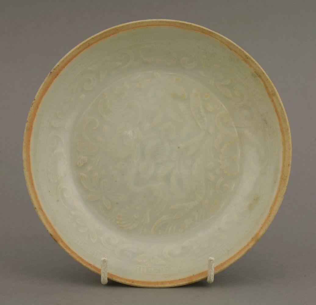 A qingbai Dish,Southern Song (1127-1279), moulded in the centre with two carp and two mandarin ducks