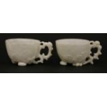 A very rare pair of white stone Wine Cups,18th/early 19th century, each bowl well carved in relief