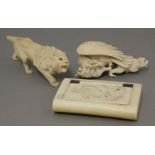 An ivory snuff box, late 19th century, the hinged cover engraved with two monkeys playing with a