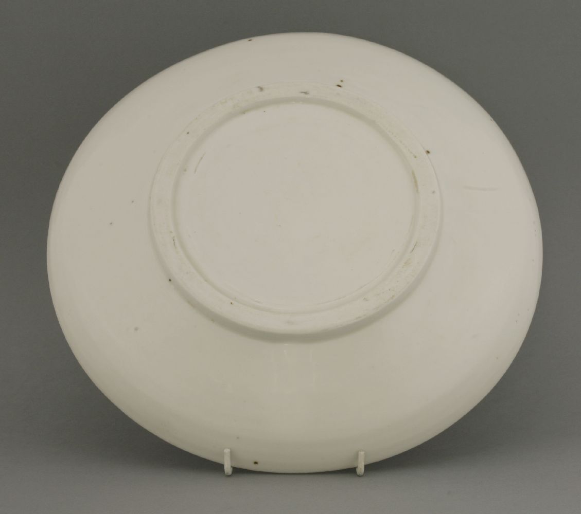 A blanc de Chine circular Saucer Dish,17th century, the front incised with a flowering bloom,29cm - Image 2 of 2