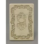 An ivory Card Case,mid-19th century, one face with central arcaded panel of figures in a garden, the