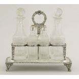 A George III silver eight-bottle cruet standby Thomas Robins, London 1815,of oblong form with