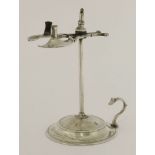 An 18th century silver wax jack,maker's mark IL and lion passant,the domed circular base with