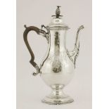 A George III silver coffee pot,possibly by James Sutton, London 1780,of elongated baluster form on