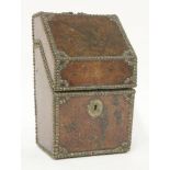 A leather covered cutlery box,probably 18th century German,with stud work borders,31cm high