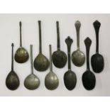 A collection of ten pewter and base metal spoons,two with touch marks,including two with acorn