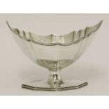 A George III silver sugar basket,by Charles Hougham, London 1789,of faceted vase shape on