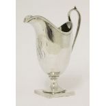 A late 18th/early 19th century silver cream jug, HBstruck with maker's mark 'PS' in a heart to base,