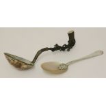 A silver hanoverian pattern spoon with mother-of-pearl bowl,unmarked,the stem terminating a leaf