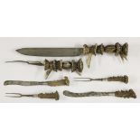 A pair of Victorian carvers,each with vertebrae handles and steel blade and tines,the knife 44cm