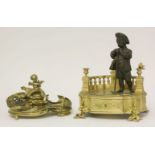 A French ormolu inkstand,19th century, a bronze figure of a garden boy leaning on his rake, within a