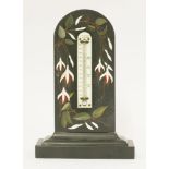 An Italian black marble desk thermometer,late 19th/early 20th century, with inlaid flowering