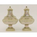 A pair of pierced porcelain pot pourri and covers,20th century, in the Sèvres style, each with a