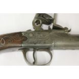 A flintlock pocket pistol,by W Clark, c.1800, with screw-off barrel and engraved lock, the walnut