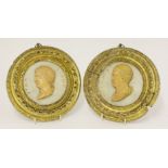 A pair of circular Grand Tour plaques,18th century, each a carved relief bust in yellow marble,